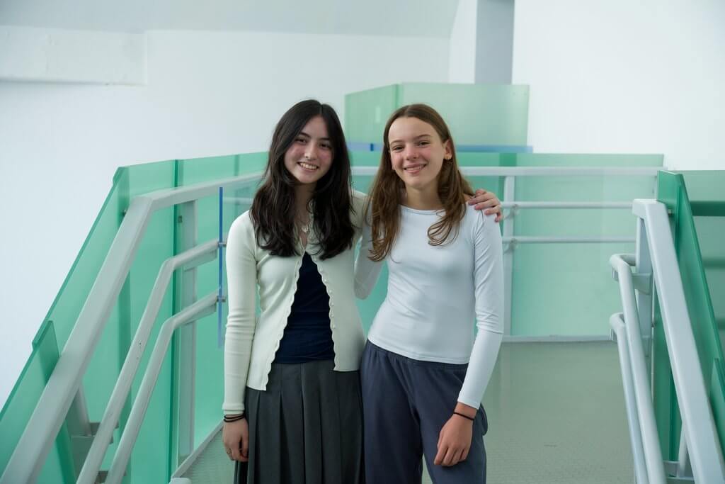 Two girls smiling together